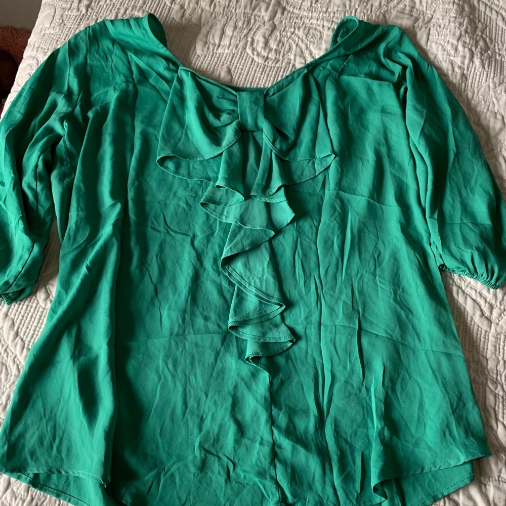 Green shirt with bow on back
